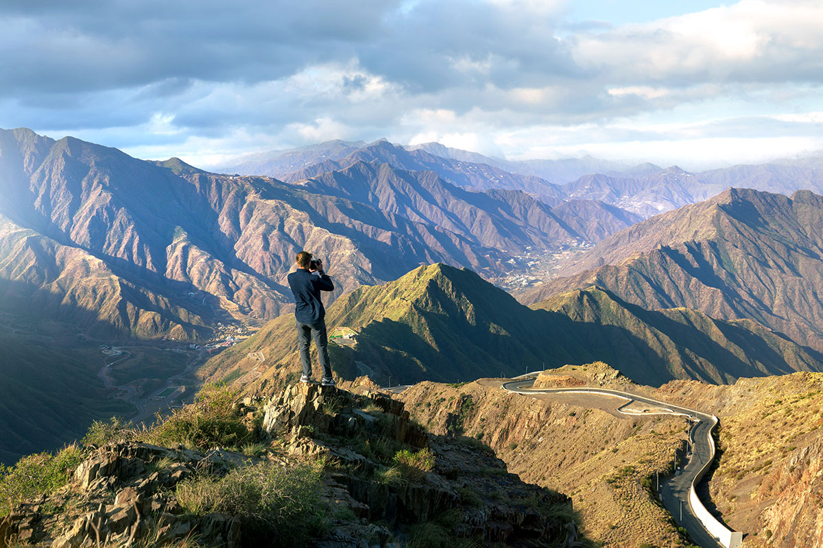 View of photographer that overlooks mountains with roads.